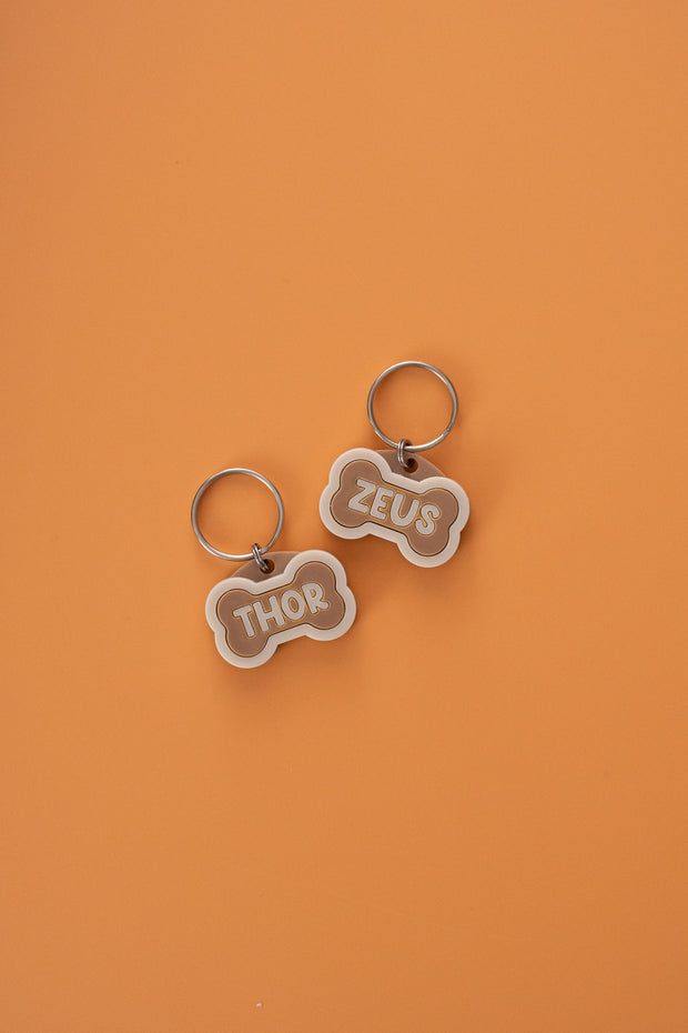 <h2>ADD A<br/><span style="text-decoration:underline">CHARM</span><br/>TO YOUR<br/>PET TAG</h2>